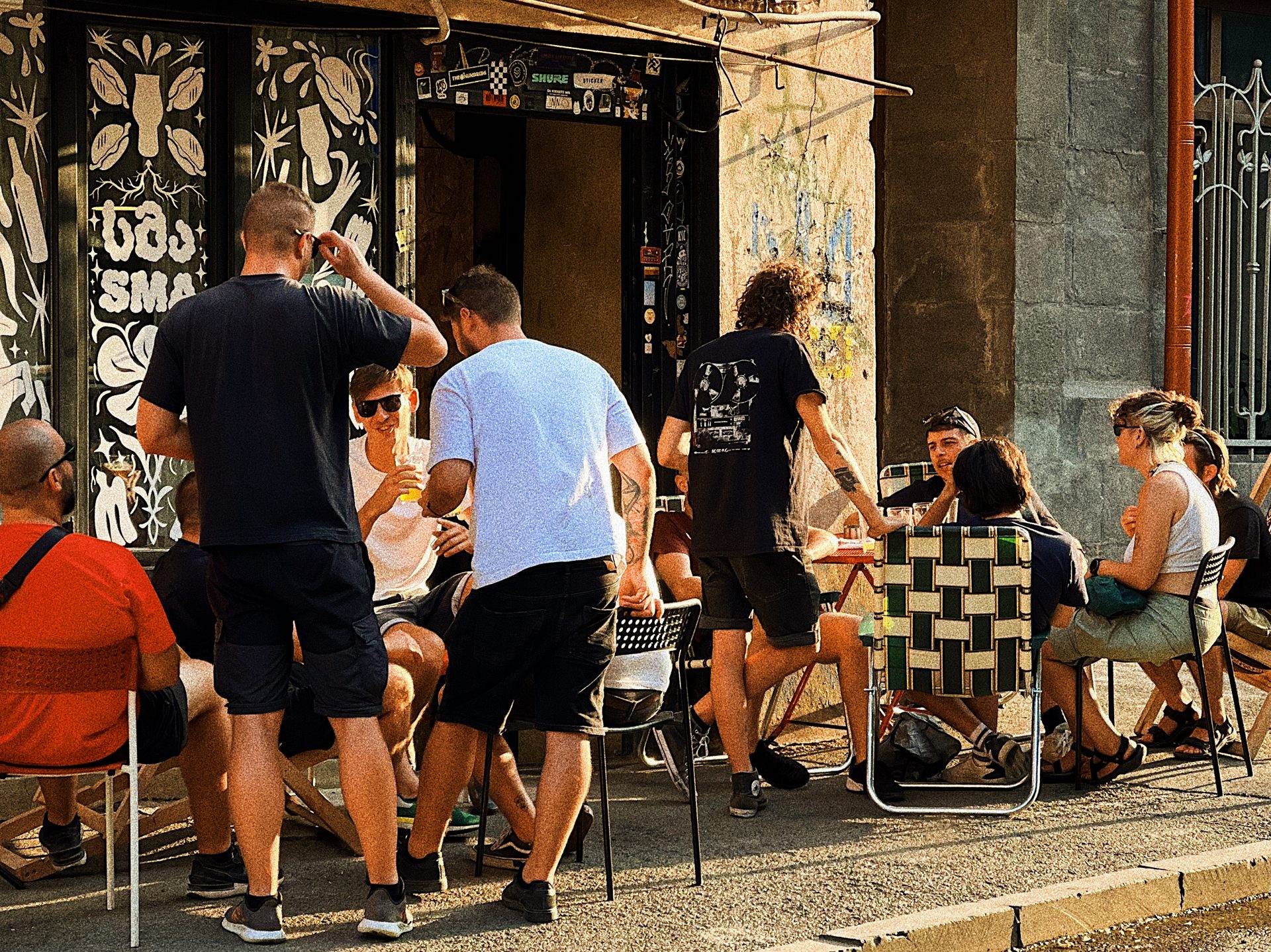SMA Craft Beer Bar exterior in Tbilisi, Georgia — people enjoying craft beer on sidewalk terrace