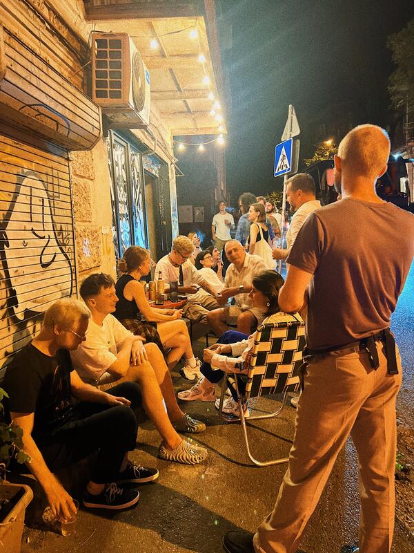 Evening crowd outside SMA craft beer bar Tbilisi